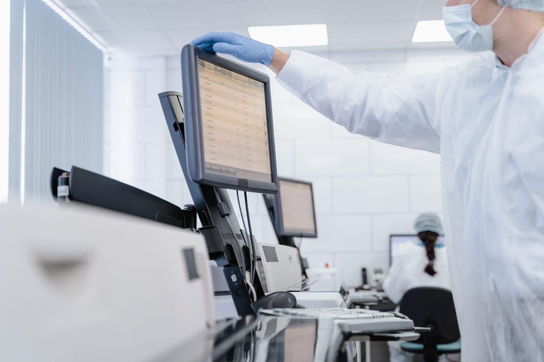 An analyst at an instrument workstation